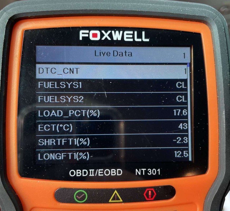 Foxwell NT301 scan tool displaying diagnostic codes, live data, and freeze frame information