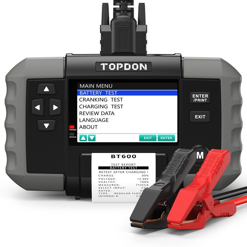 Technician checking a car battery with a TOPDON scanner, showing battery health and system voltage readings