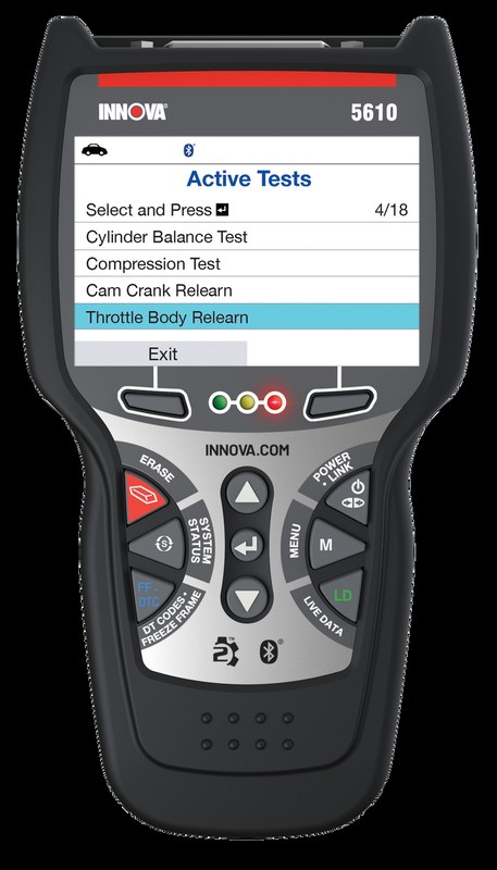 Innova 5610 OBD2 scanner connected to a vehicle dashboard for diagnostic code reading