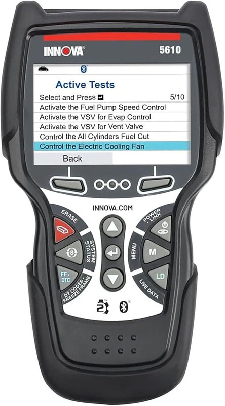 Innova 5610 scan tool connected to a car dashboard showing diagnostic trouble codes