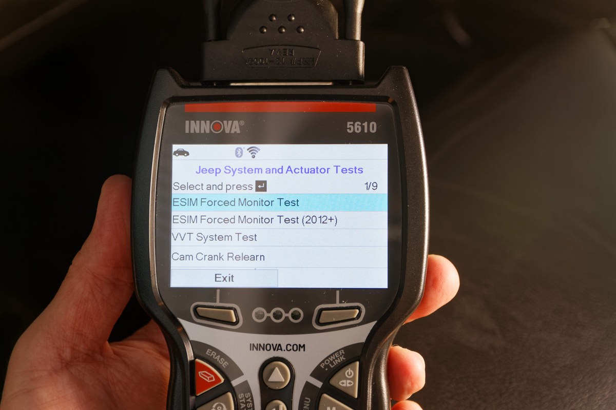 Innova 5610 V2 scanner displaying live data and emissions readiness on an automotive diagnostic screen