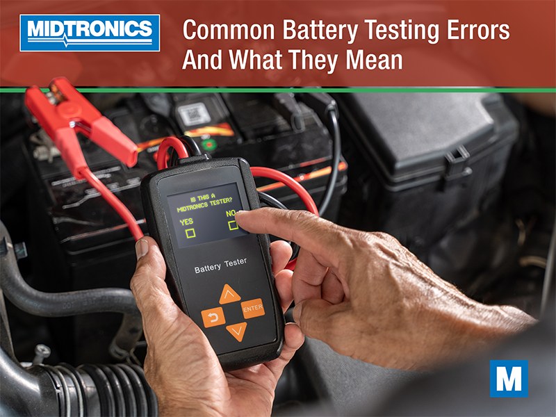 Mechanic using an OBD2 scanner to diagnose a car battery and electrical system