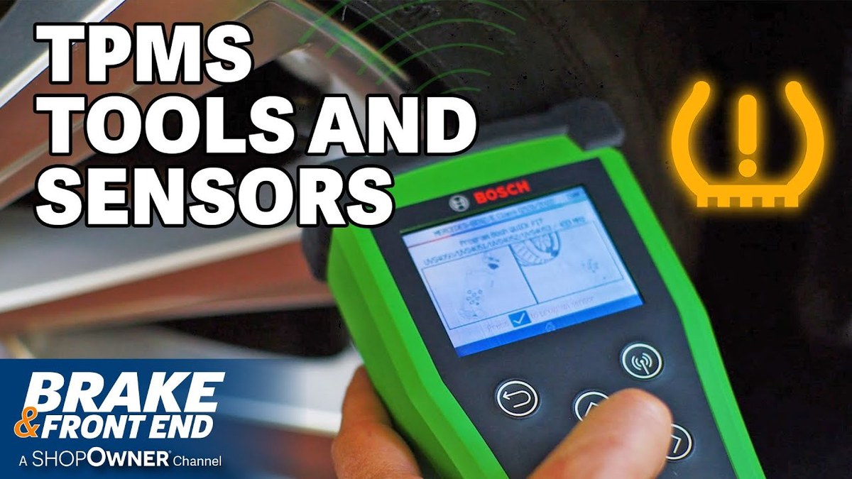 Mechanic checking tire pressure and vehicle readiness before using a TPMS reset tool
