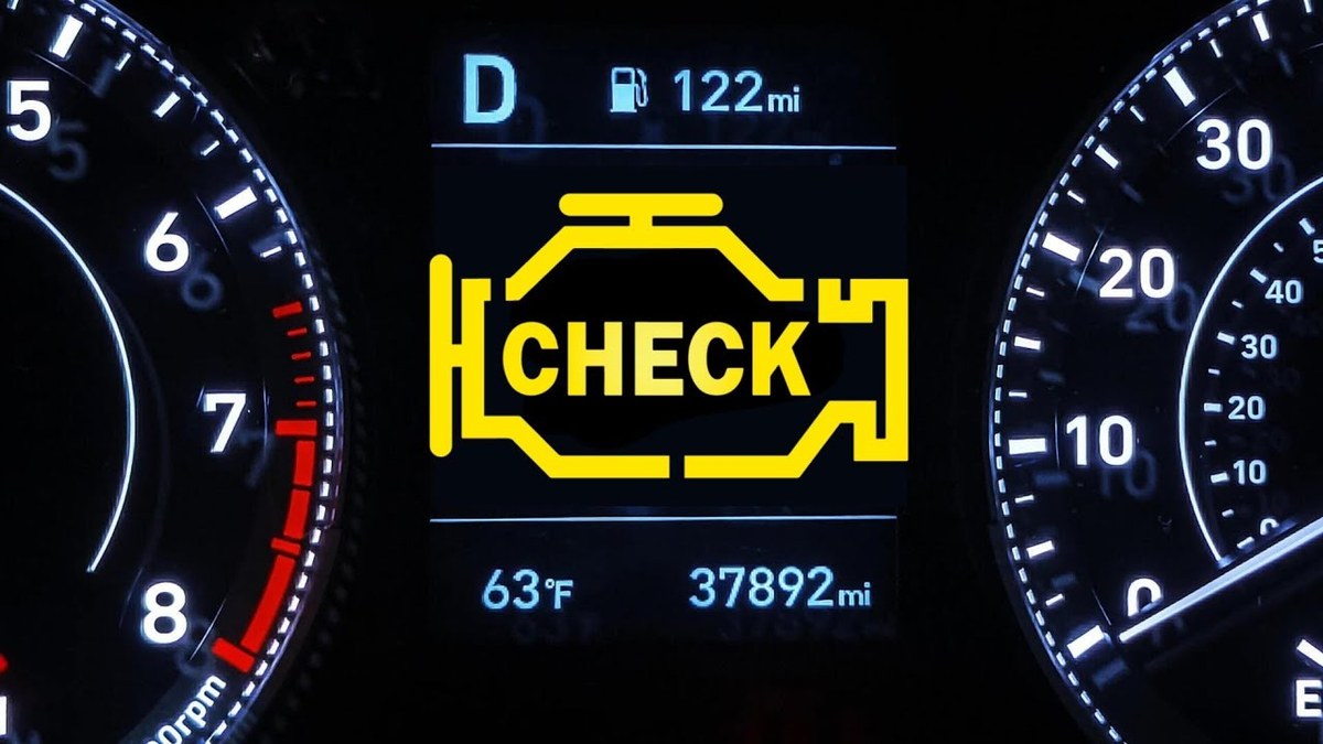 Car dashboard with check engine light illuminated while engine appears to run normally