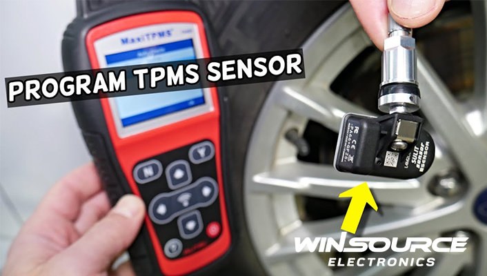 OBD2 scanner displaying TPMS diagnostic codes and live sensor data during vehicle inspection