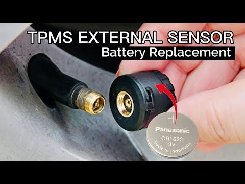 Sealed TPMS sensor battery with tire valve stem, showing non-replaceable design.